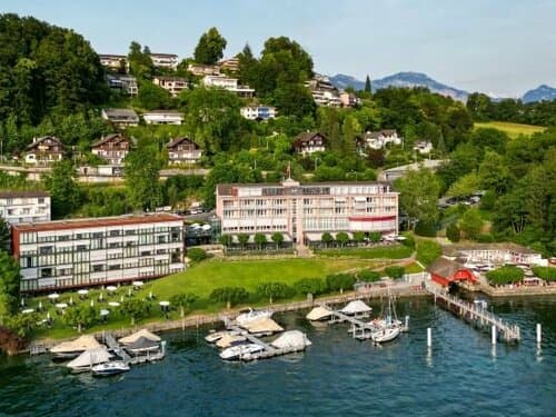 Внешний вид отеля Hermitage Lake Lucerne - Beach Club & Lifestyle Hotel